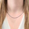 Close up of the "Maria" Chain as shown on a model. Chain is shown at 18" long and oxidized. Model is wearing a white v-neck shirt. Links are 4x3mmx.8mm thick.