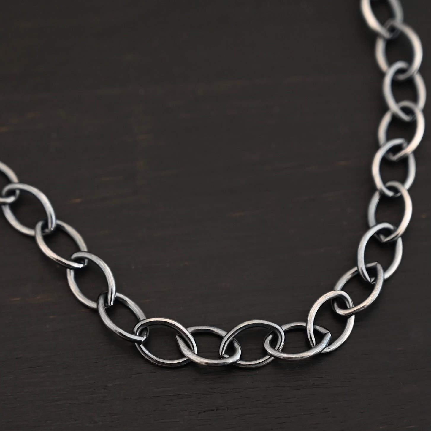 Sky Chain, Oxidized, Smooth Close up of the oxidized sterling silver Sky Chain that is made with large oval links that are smooth and connected together