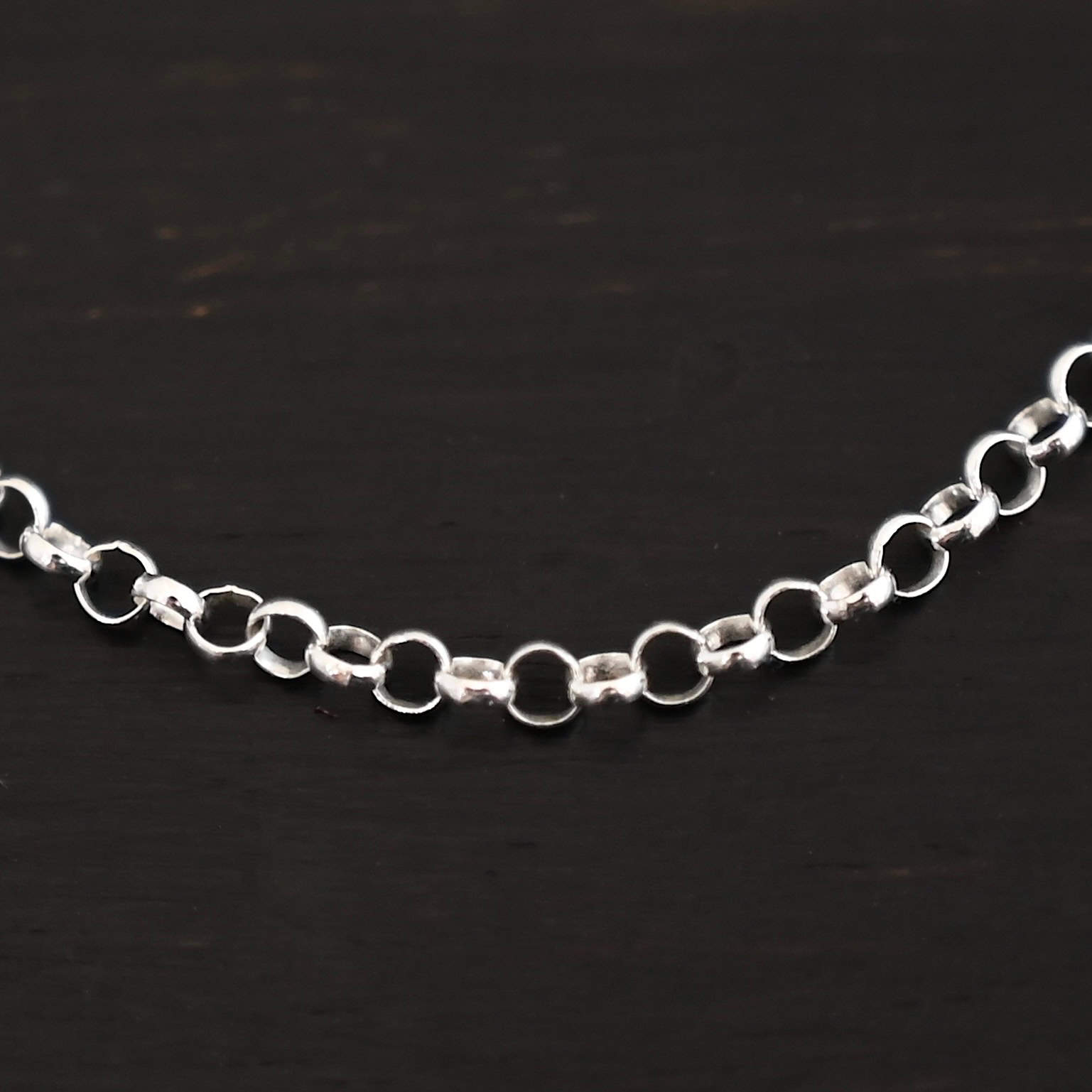 "Rachel Rolo" Chain as shiny. Made out of sterling silver. Chain is made out of small, but thick circles that are connected to one another.