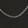 Close up of an oxidized sterling silver Maria Chain with circle links that is laying on a dark background. Links are 4x3mmx.8mm thick.