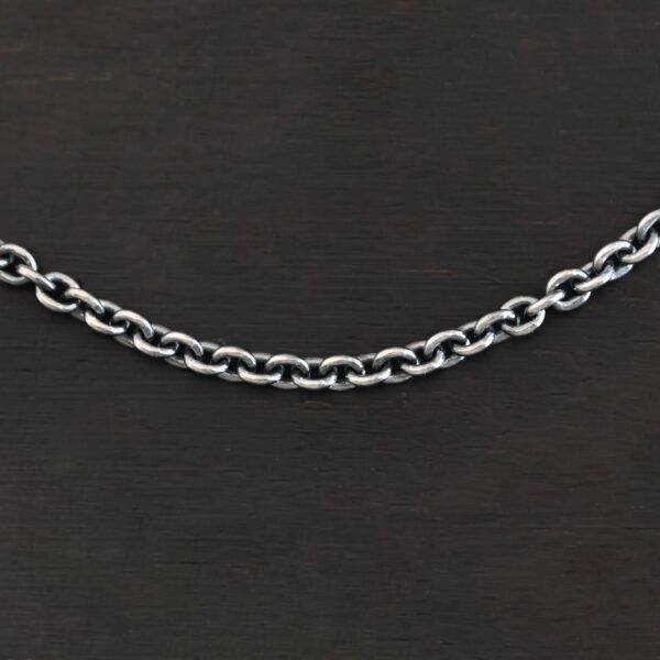 Close up of oxidized sterling silver Lauren chain with oval links laying against a dark background. Links measure 5x4mmx1mm thick.