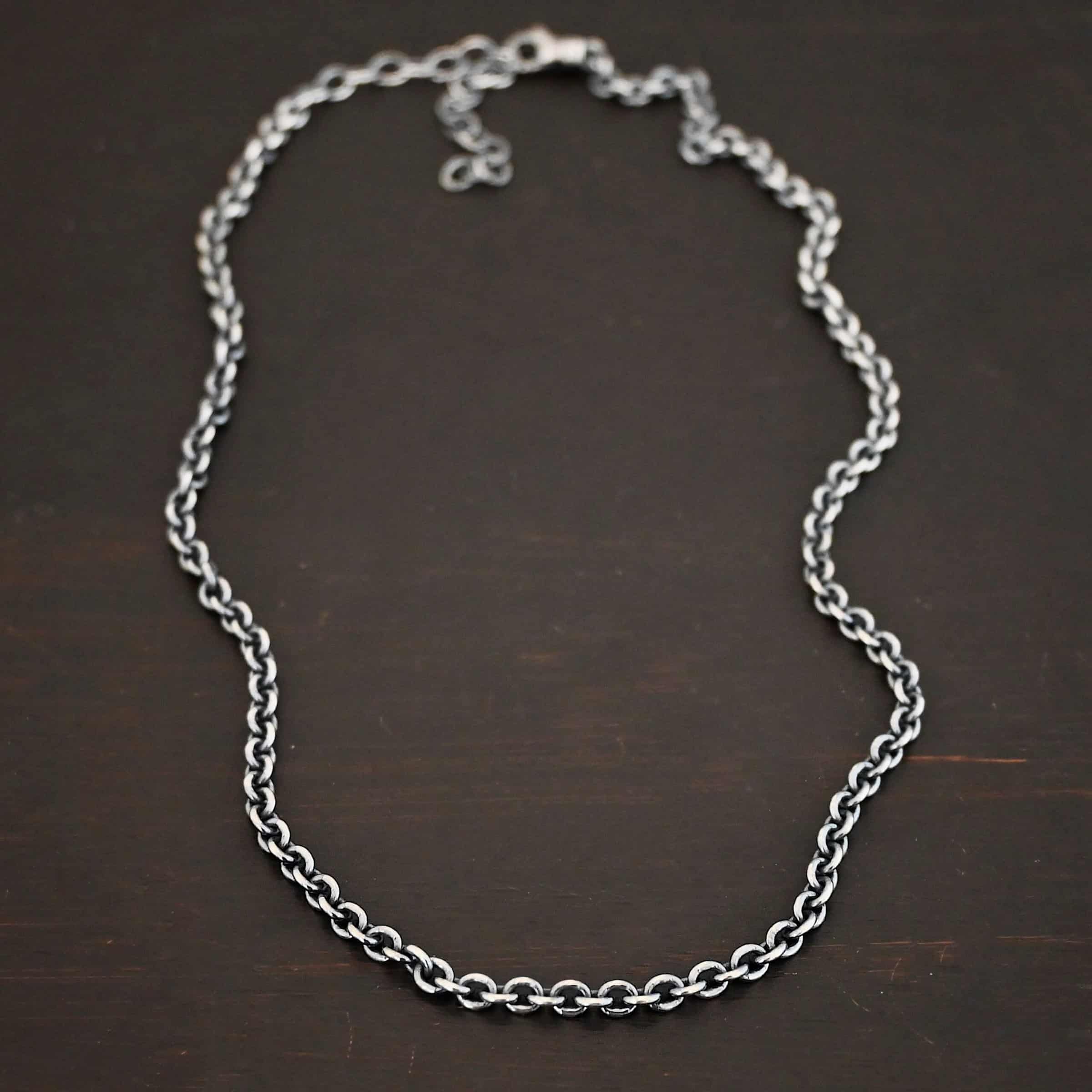 Oxidized sterling silver Lauren chain with oval links laying against a dark background. Links measure 5x4mmx1mm thick.