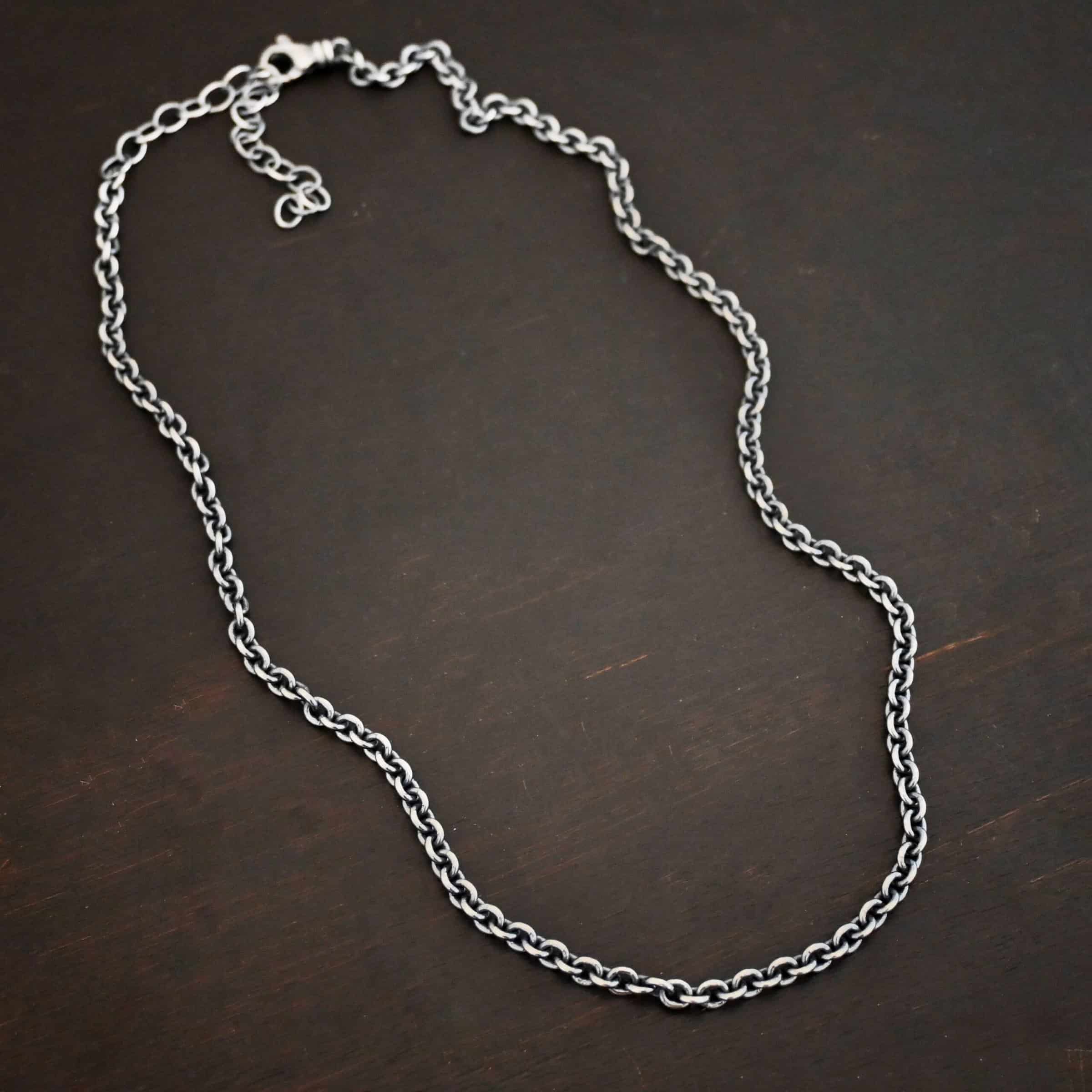 Oxidized sterling silver Lauren chain with oval links laying against a dark background. Links measure 5x4mmx1mm thick.