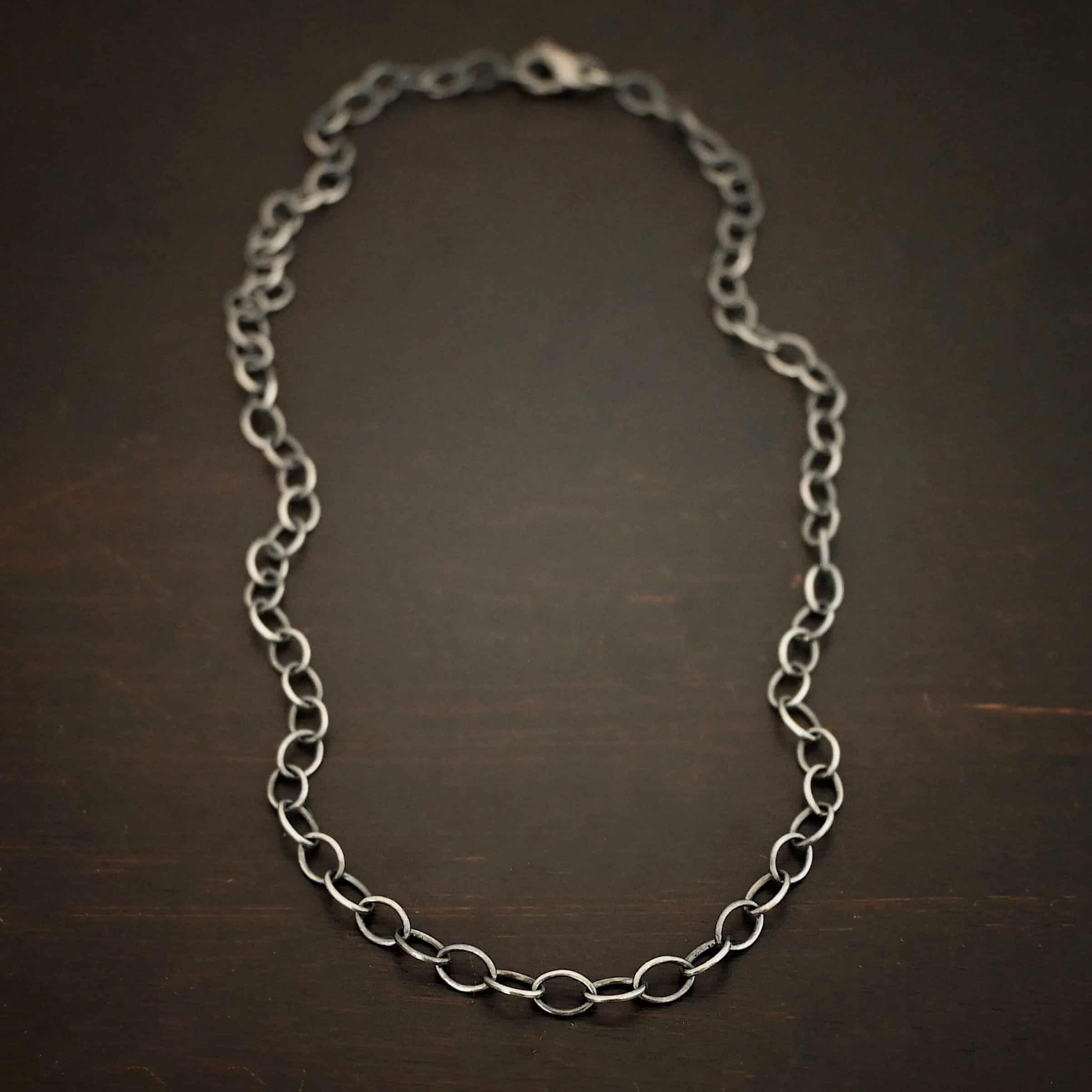 Willow Chain Sterling silver oxidized Willow oval chain shown on dark background. Oval links measure 6.5×4.7mm