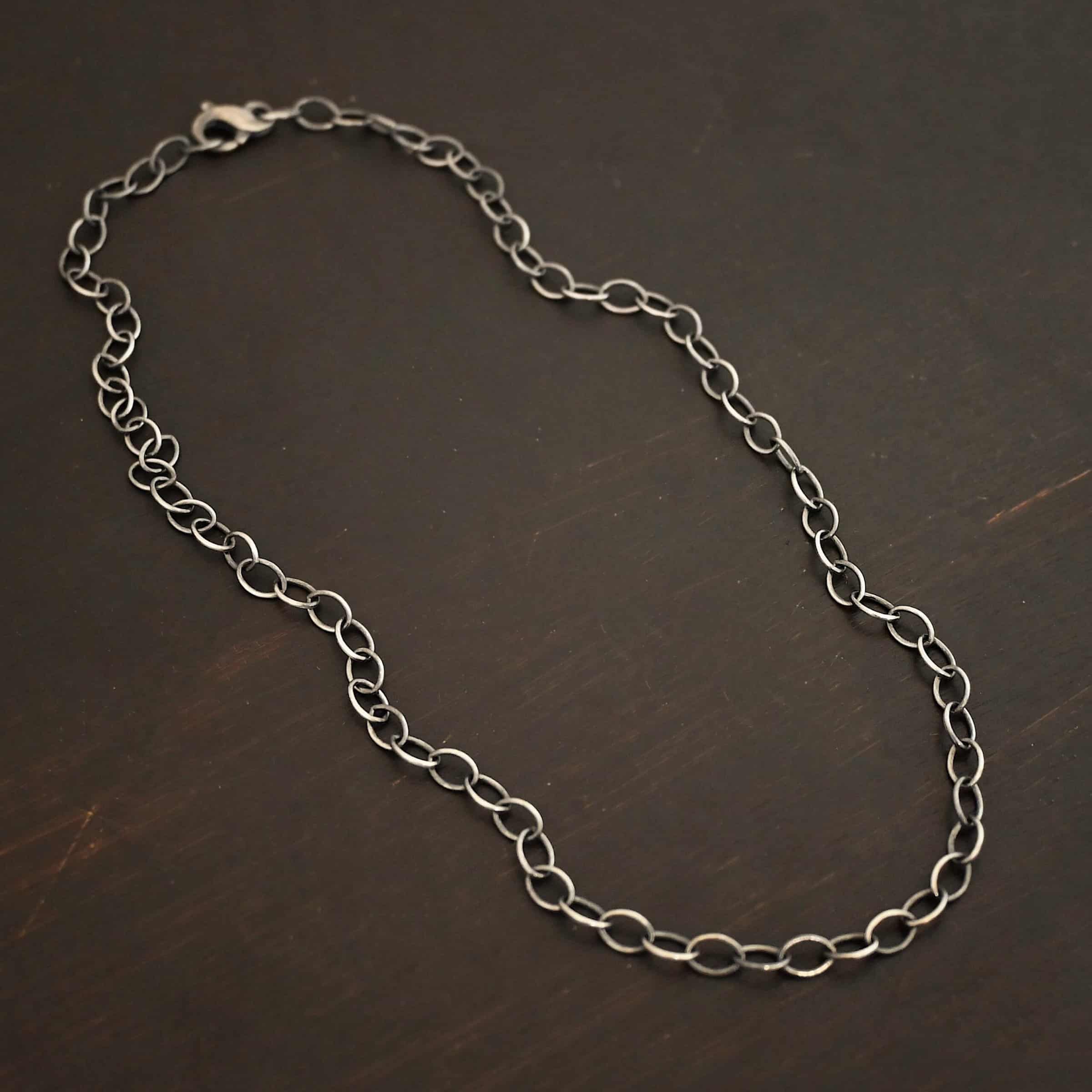 Willow Chain Sterling silver oxidized Willow oval chain shown on dark background. Oval links measure 6.5×4.7mm