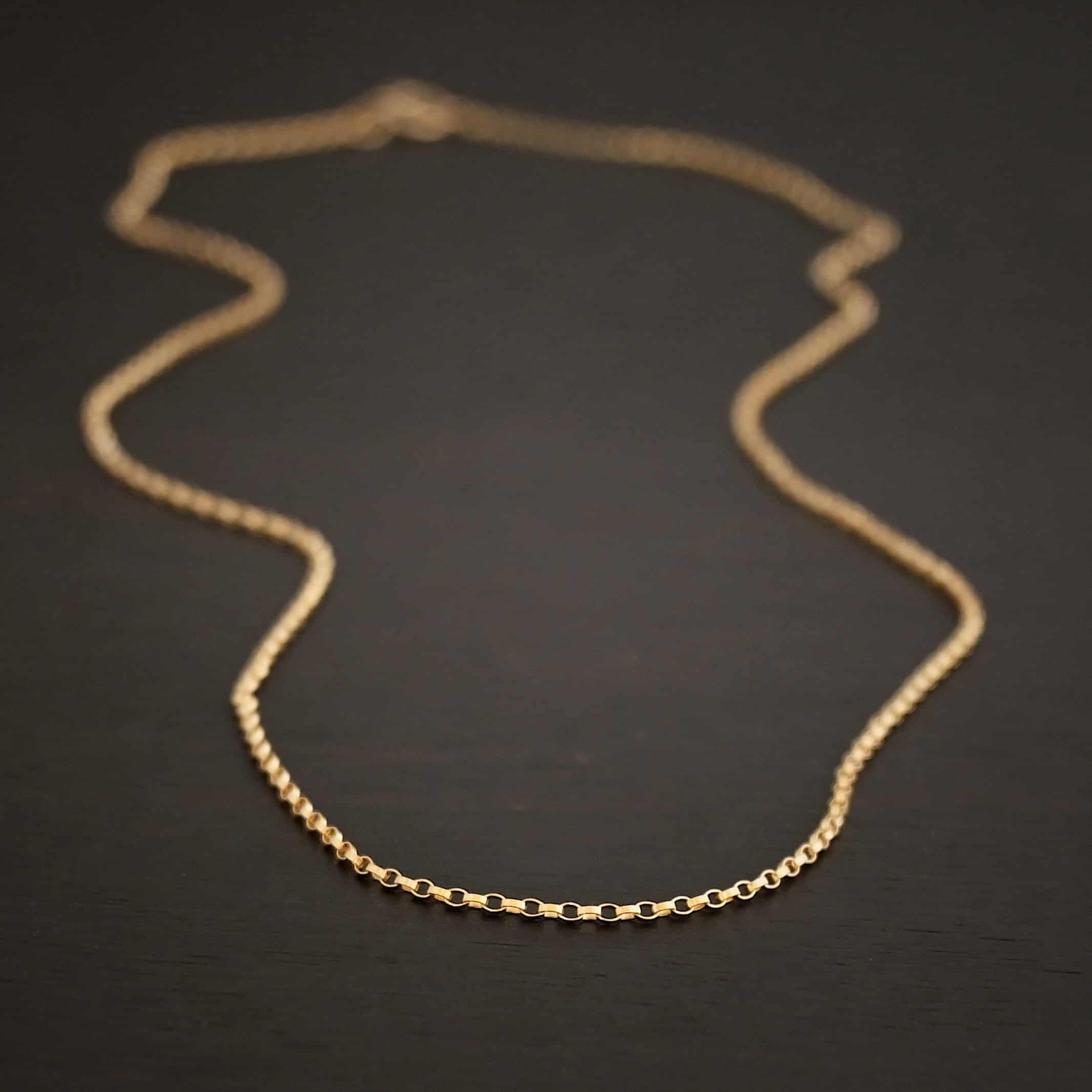 Close up of the "Jessica Rolo" Chain as shown against a dark background. Chain is 1.2mm thick and 14K Gold Filled over sterling silver.