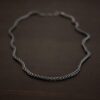 Close up of the "Frenchie" Chain. Sterling silver chain with an oxidized finish. It is a heavy french wheat chain that is 2.3mm. Chain is shown against a dark background.