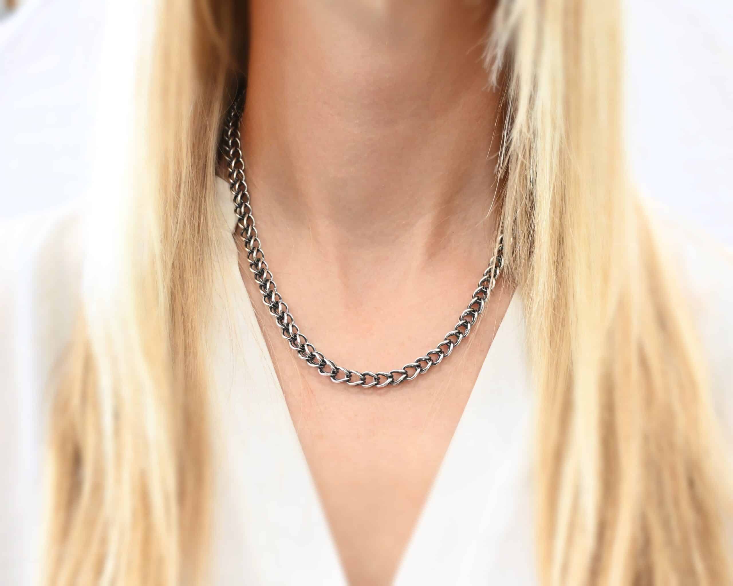 Gretchen Chain Photo of the "Gretchen" Chain. Chain is made out of sterling silver and oxidized. Chain is a viking knit chain, and approximately 18" long. Chain has a toggle clasp. Chain is worn by a model to demonstrate size.