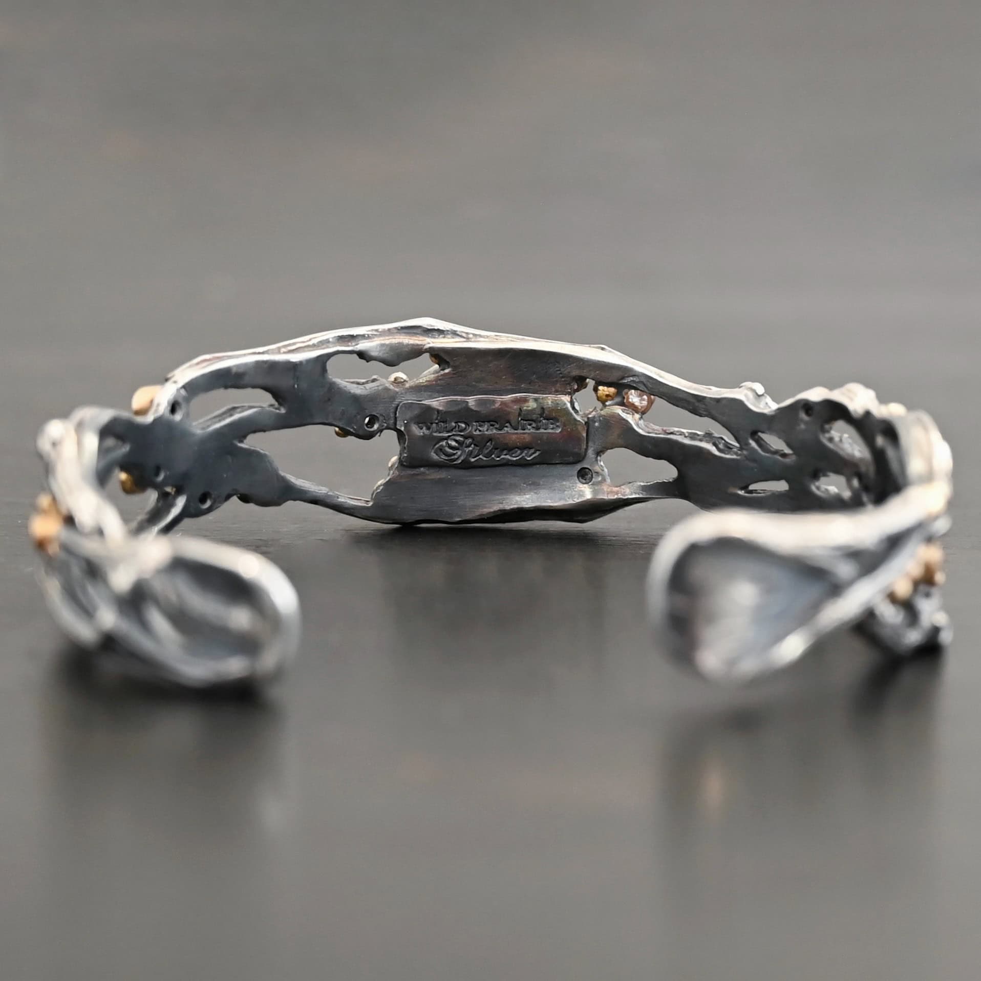 Night Flowers Cuff Inside of a cuff with "Wild Prairie Silver" stamped into it.