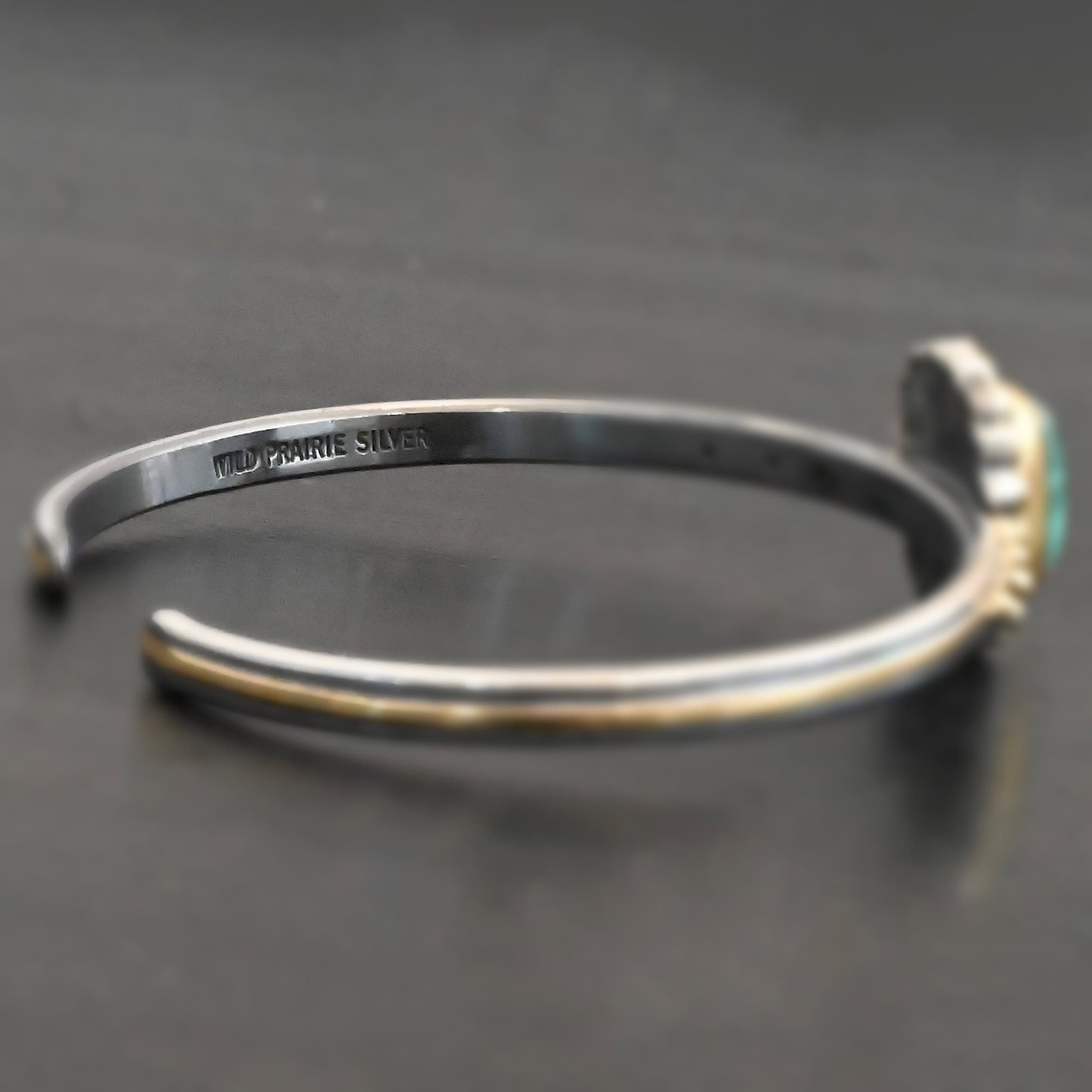 Inside of a cuff with "Wild Prairie Silver" stamped into it.
