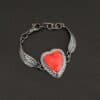 Heart On Fire Bracelet new "Heart On Fire" Bracelet. The bracelet is a rosarita heart with medium sized angel wings on each side. The angel wings curve lightly so they can fit around the wrist. There is two layers of hammered sterling silver around the heart. Bracelet has a silver lobster claw clasp.