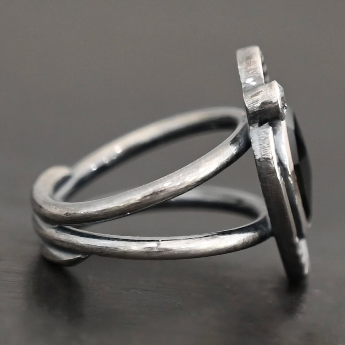 Kala Ring Photo of the side of the "Kala" Ring. The ring band is two bands that meet at the back and leave a hollow center for the band.