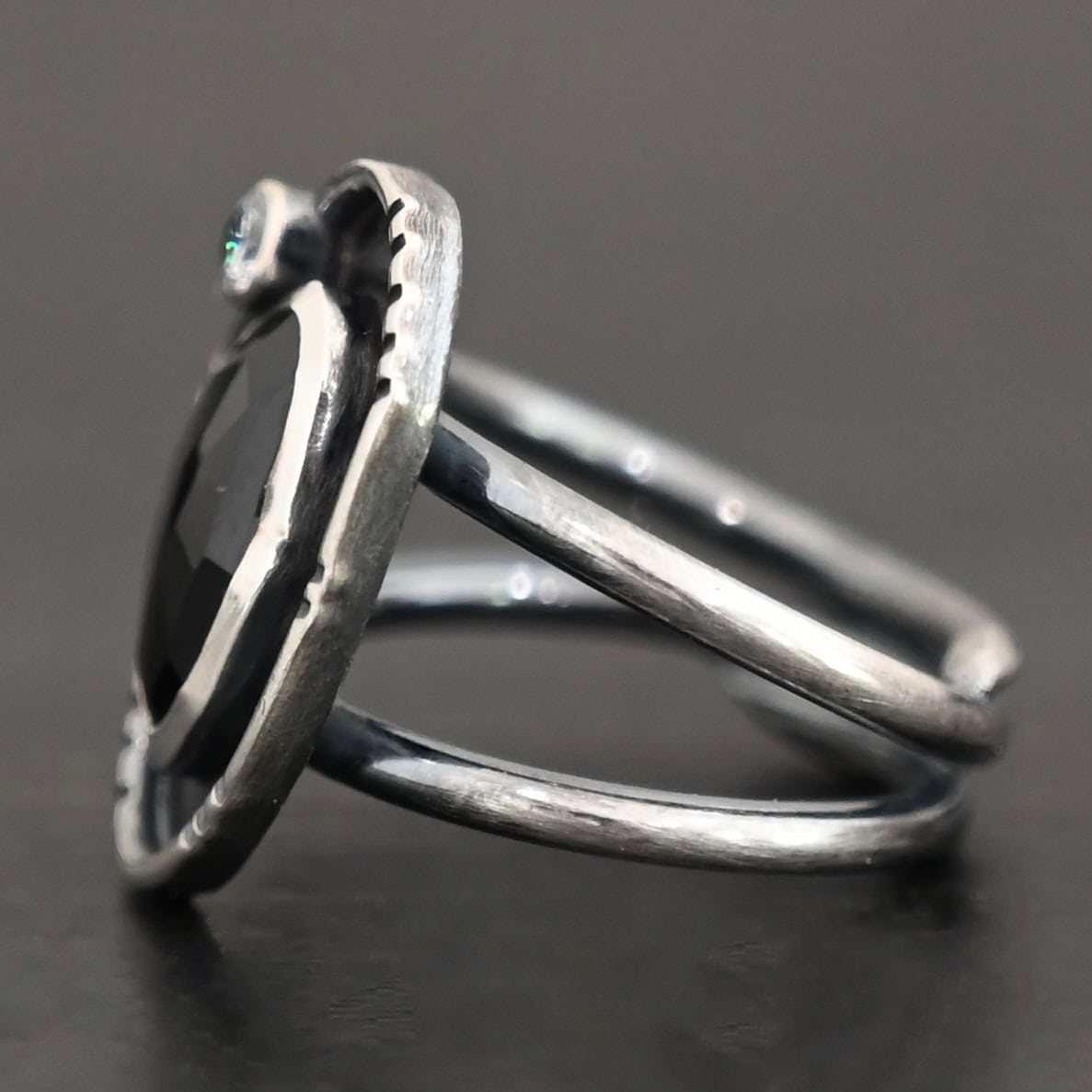 Kala Ring Photo of the side of the "Kala" Ring. The ring band is two bands that meet at the back and leave a hollow center for the band.