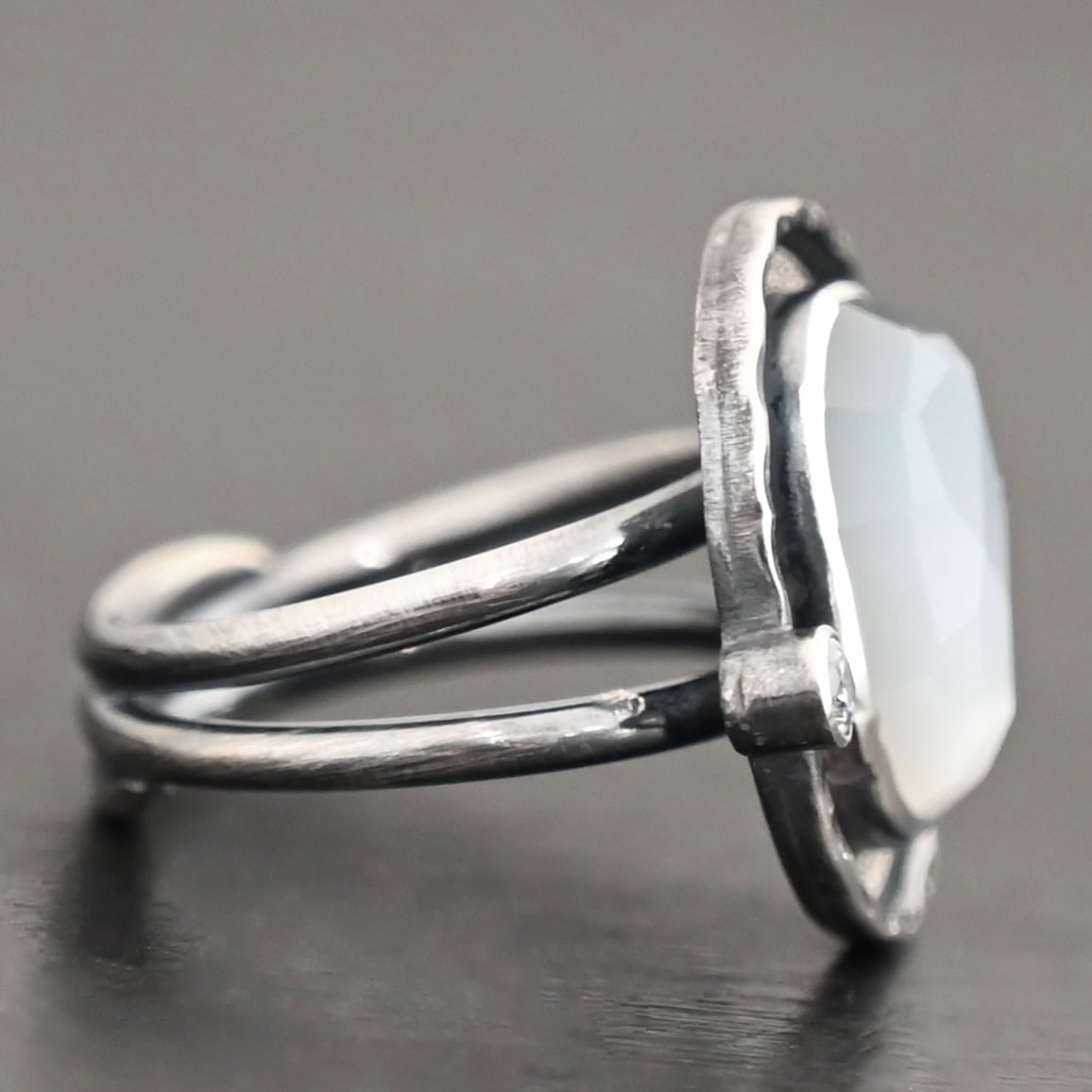 Photo of the "Lainey" Ring. The ring band is two bands that meet at the back and leave the center hollow.