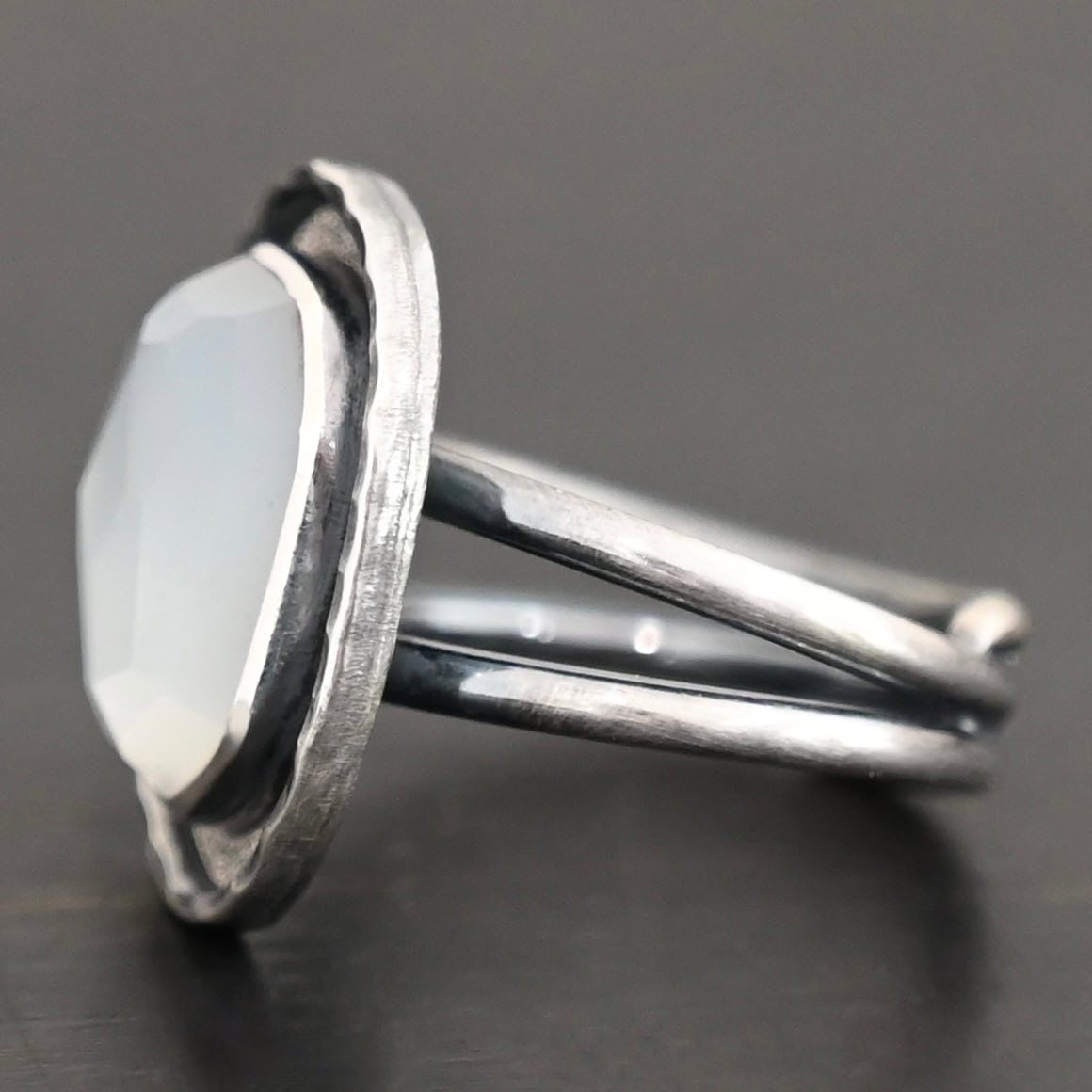 Photo of the "Lainey" Ring. The ring band is two bands that meet at the back and leave the center hollow.