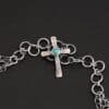 "Firm In Faith" Necklace Clasp. Necklace has a small silver cross with a turquoise in the center of it for the clasp.