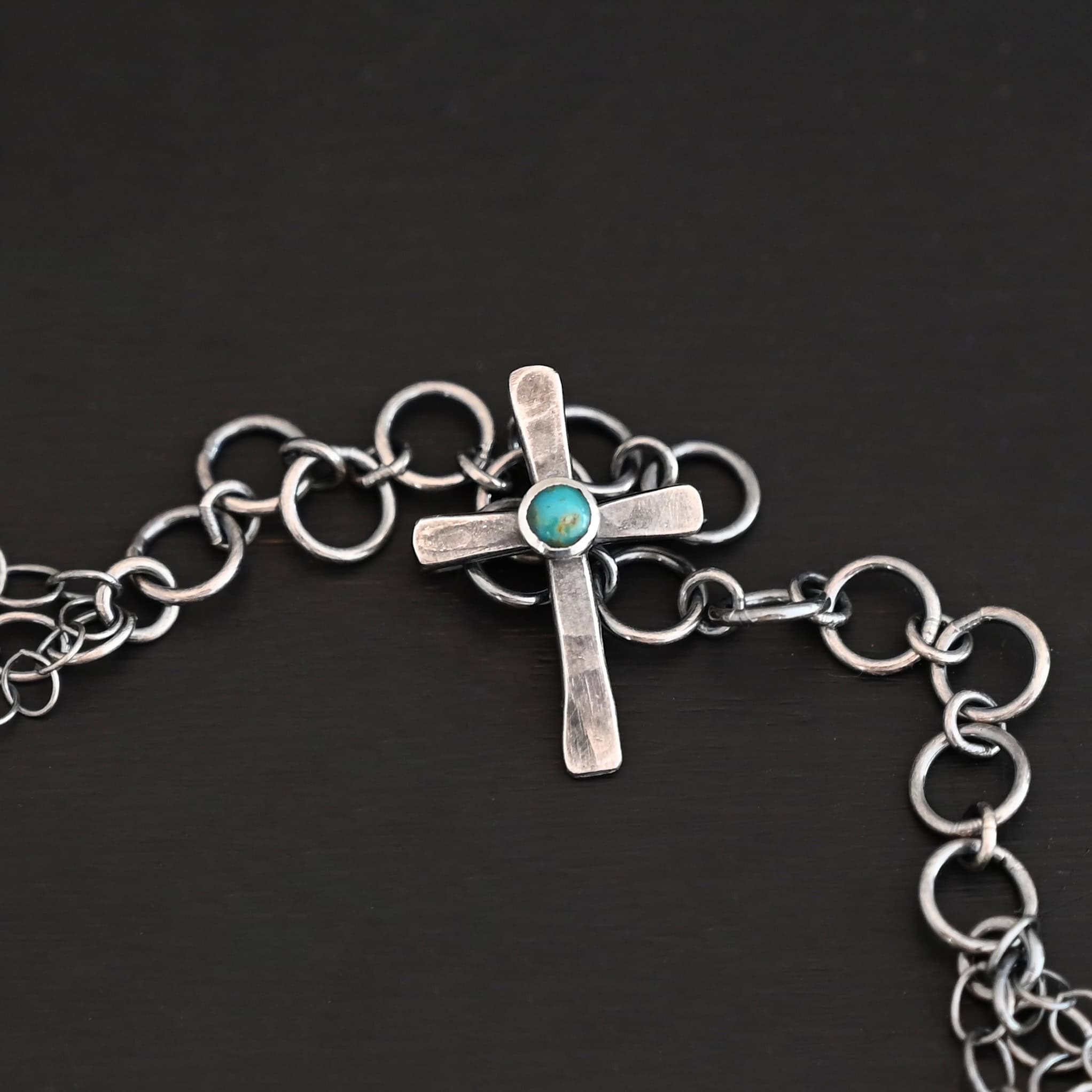 Firm In Faith Necklace "Firm In Faith" Necklace Clasp. Necklace has a small silver cross with a turquoise in the center of it for the clasp.