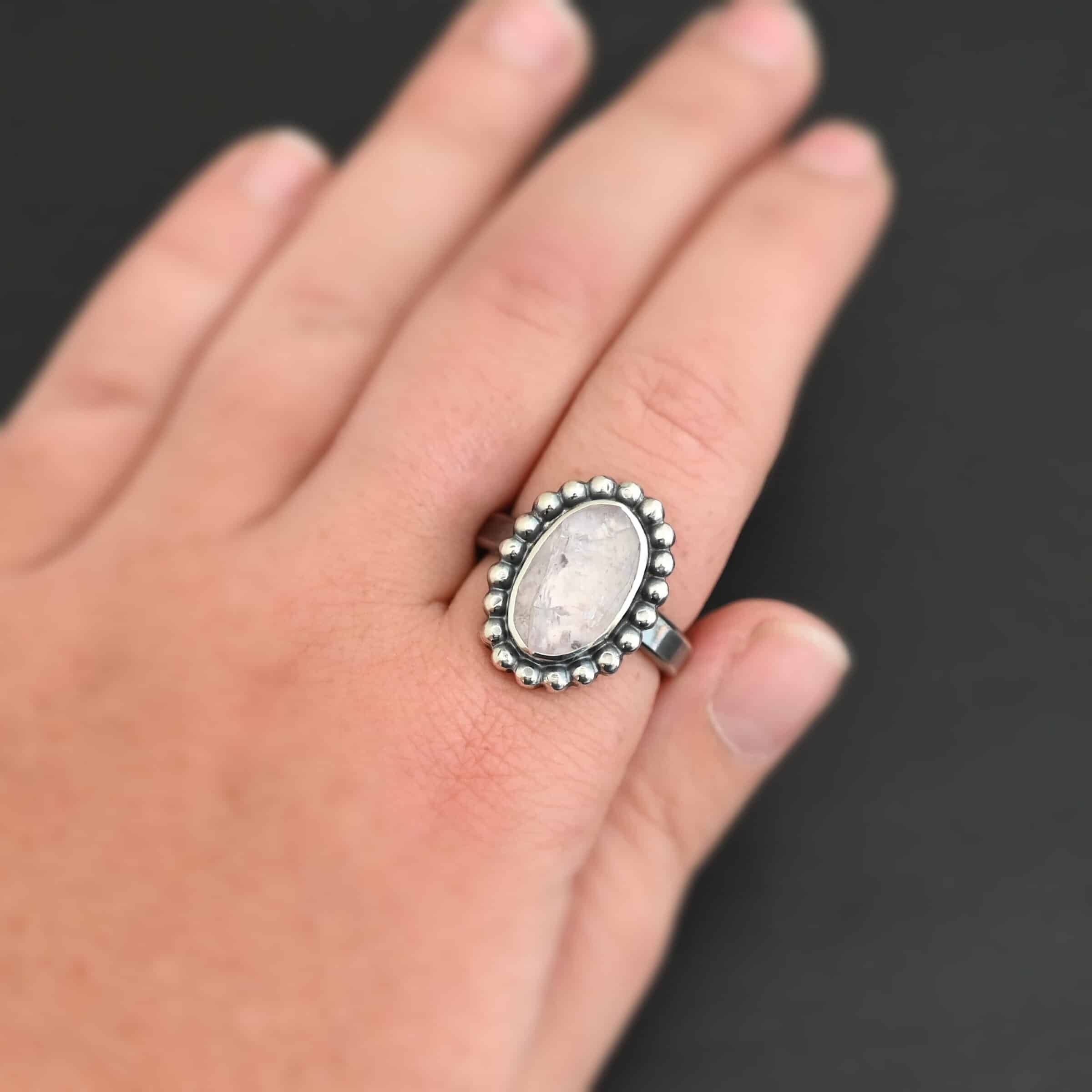 Calliope Ring "Calliope" Ring. Sterling Silver & Morganite. There is an oval, vertical morganite in the center with balls of silver circling all the way around it. Ring band is smooth & lightly oxidized.